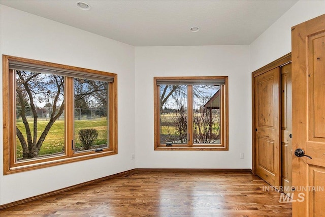 spare room with light wood-type flooring