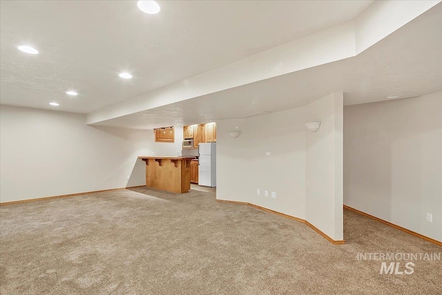 unfurnished living room featuring light colored carpet