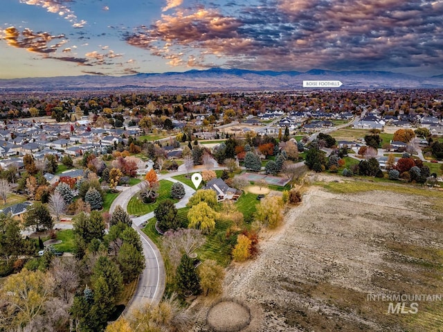 aerial view at dusk with a mountain view