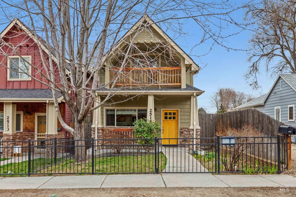 2515 N 21st St, Boise, ID 83702 - view of front of home with a fenced front yard, stone siding, and a gate