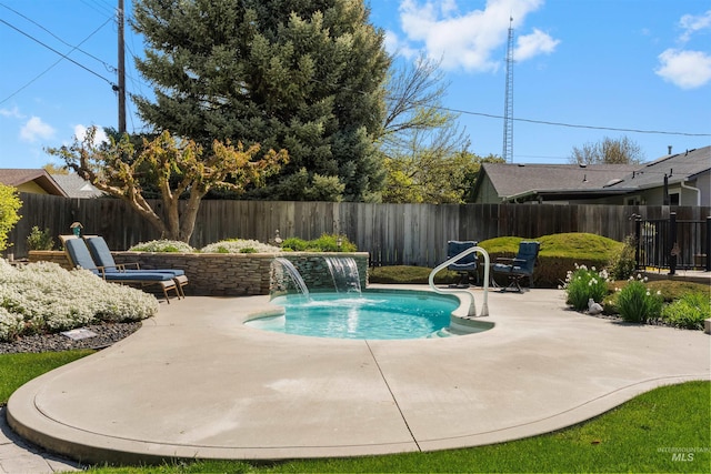 view of swimming pool with a fenced backyard, a fenced in pool, and a patio