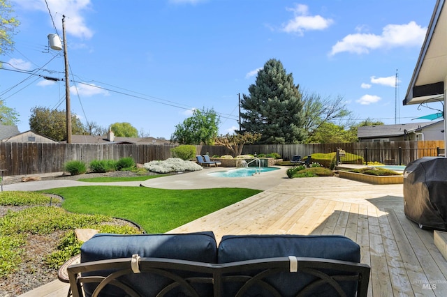 view of yard featuring a fenced in pool, a fenced backyard, and a deck