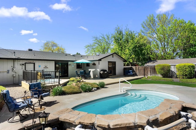 view of swimming pool with a fenced in pool, a patio area, and fence