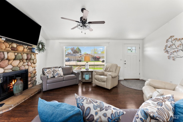 living room featuring plenty of natural light, ceiling fan, hardwood / wood-style floors, and a fireplace