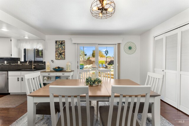 dining room featuring dark wood-style flooring