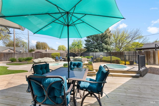 wooden terrace featuring a fenced in pool, a fenced backyard, and a hot tub