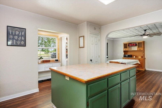 169W 200 N, Jerome, ID 83316 - kitchen featuring green cabinets, dark wood-type flooring, a kitchen island, baseboards, and ornamental molding
