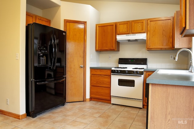 kitchen featuring light tile patterned flooring, black fridge with ice dispenser, white range oven, and sink