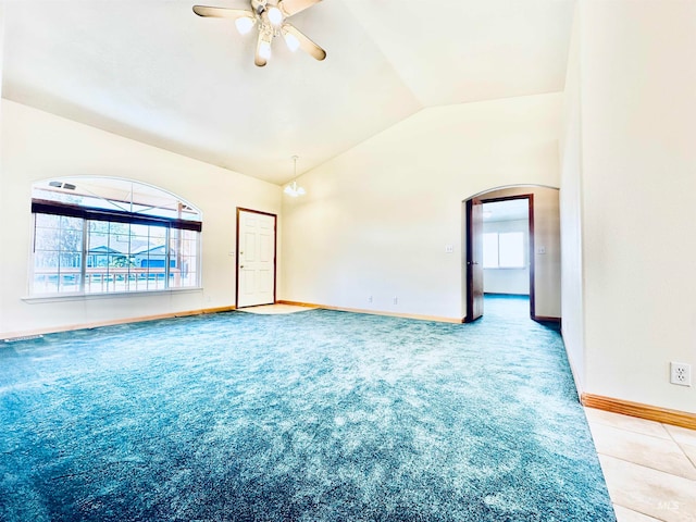 spare room with ceiling fan, carpet floors, and lofted ceiling