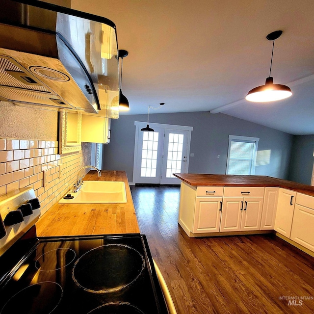 102 N Main St, Council, ID 83612 - kitchen featuring butcher block countertops, a sink, exhaust hood, dark wood-type flooring, and vaulted ceiling