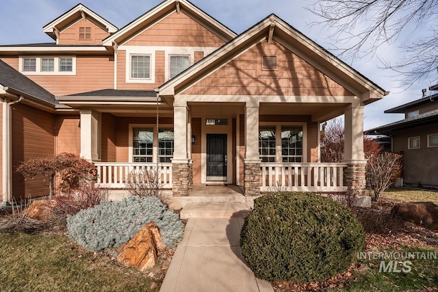 craftsman-style home with covered porch