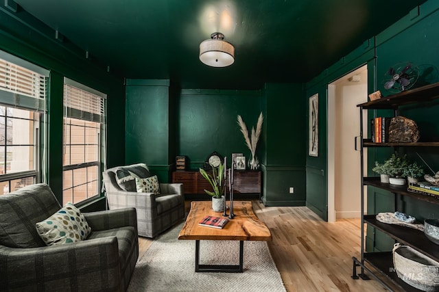 sitting room featuring wood-type flooring