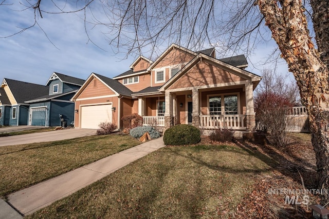 craftsman-style home with a front lawn, a porch, and a garage