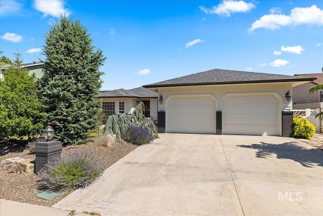 1902 E Birchwood Dr, Eagle, ID 83616 - view of front of home featuring driveway and an attached garage