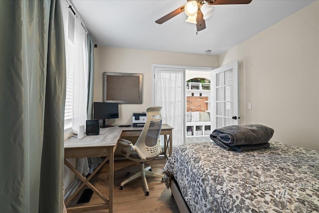 1902 E Birchwood Dr, Eagle, ID 83616 - bedroom featuring wood finished floors, an office area, and ceiling fan