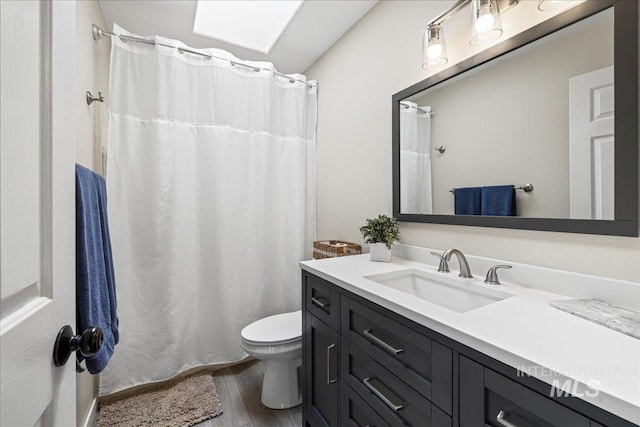 1902 E Birchwood Dr, Eagle, ID 83616 - bathroom with vanity, wood finished floors, and a shower with shower curtain