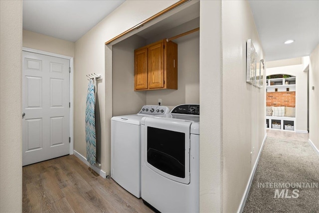 1902 E Birchwood Dr, Eagle, ID 83616 - washroom with separate washer and dryer, cabinet space, light wood-style flooring, and recessed lighting
