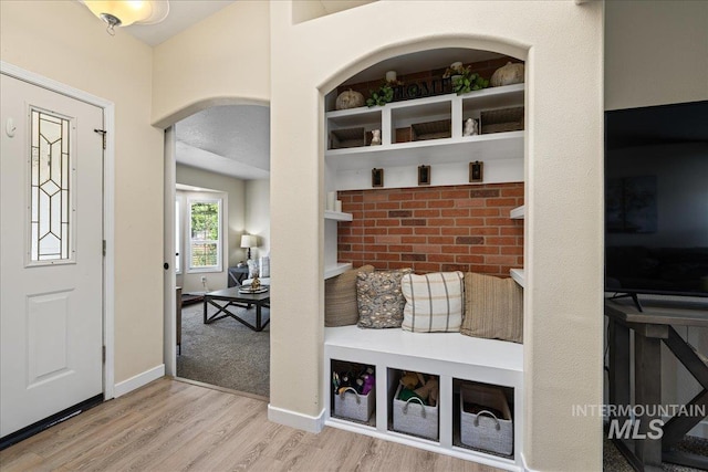 1902 E Birchwood Dr, Eagle, ID 83616 - entryway with arched walkways and wood finished floors