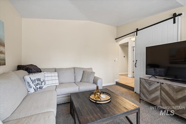 1902 E Birchwood Dr, Eagle, ID 83616 - living area with a barn door, carpet, and lofted ceiling