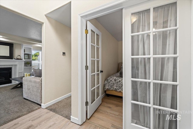 1902 E Birchwood Dr, Eagle, ID 83616 - corridor with wood finished floors and french doors