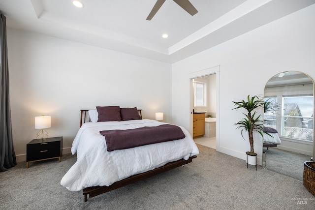 bedroom featuring recessed lighting, a raised ceiling, and carpet flooring