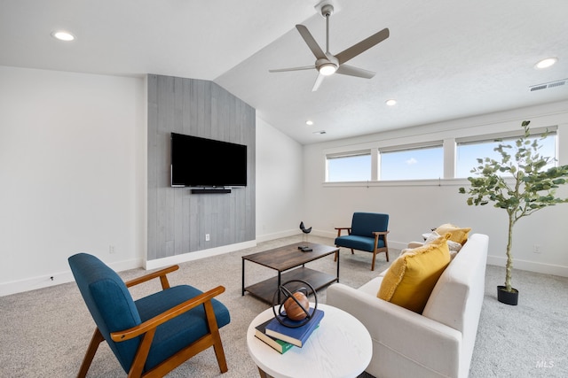 carpeted living area with recessed lighting, visible vents, baseboards, and vaulted ceiling