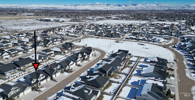 aerial view featuring a mountain view and a residential view