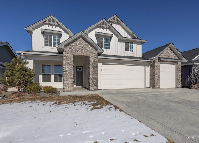 view of front of house with stone siding, board and batten siding, and concrete driveway