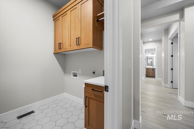 20042 N Swire Green Way Unit 459, Boise, ID 83714 - washroom featuring washer hookup, hookup for an electric dryer, cabinet space, recessed lighting, and baseboards