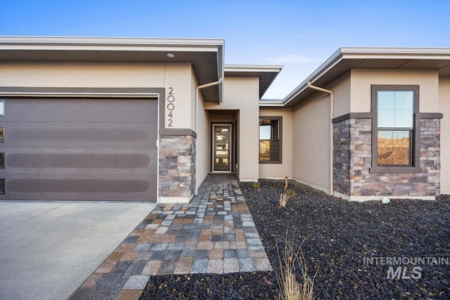 20042 N Swire Green Way Unit 459, Boise, ID 83714 - entrance to property featuring stucco siding, stone siding, and a garage