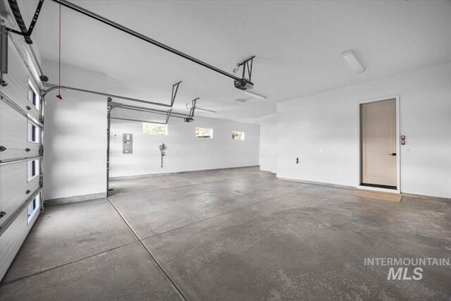 20042 N Swire Green Way Unit 459, Boise, ID 83714 - garage with a garage door opener and electric panel