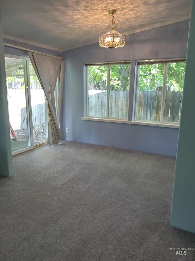 410 Cedar St, Middleton, ID 83644 - empty room featuring healthy amount of natural light, carpet flooring, and a chandelier
