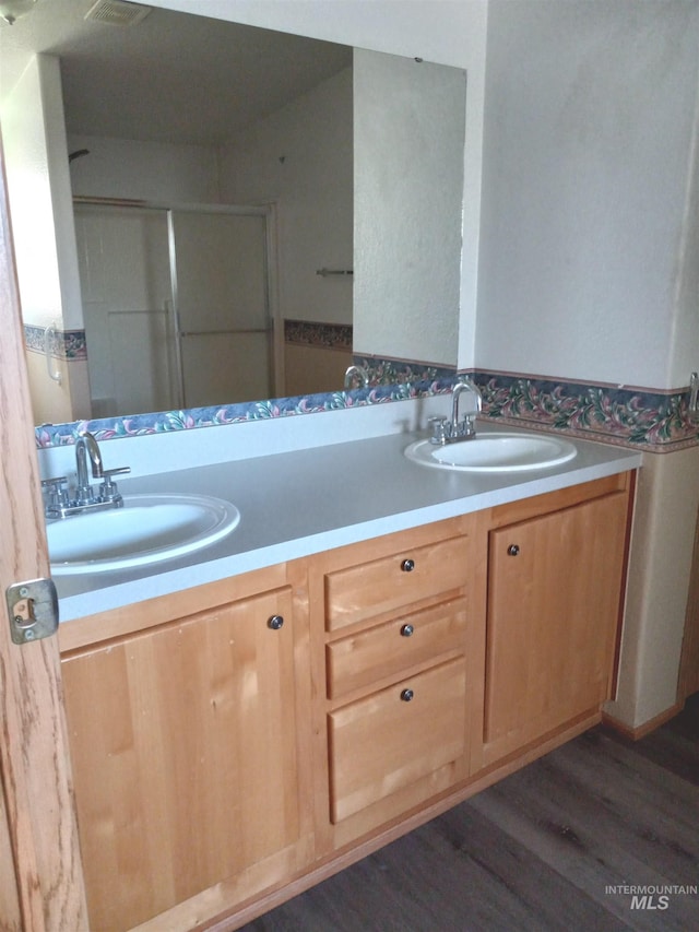 410 Cedar St, Middleton, ID 83644 - bathroom featuring double vanity, wood finished floors, and an enclosed shower