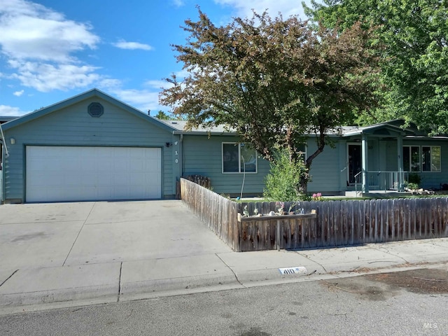 410 Cedar St, Middleton, ID 83644 - ranch-style home with a fenced front yard, a garage, and driveway