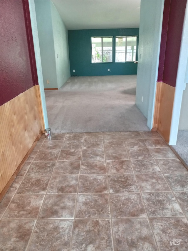 410 Cedar St, Middleton, ID 83644 - hallway featuring wooden walls, carpet flooring, and wainscoting
