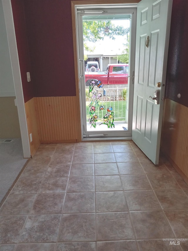410 Cedar St, Middleton, ID 83644 - entrance foyer featuring a wainscoted wall, wood walls, and tile patterned flooring