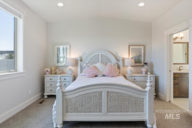 bedroom with visible vents, baseboards, recessed lighting, light carpet, and connected bathroom