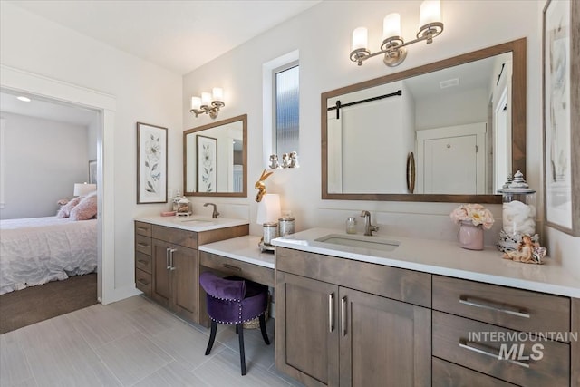 bathroom with vanity and ensuite bathroom