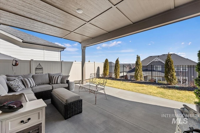 view of patio / terrace featuring an outdoor living space and a fenced backyard