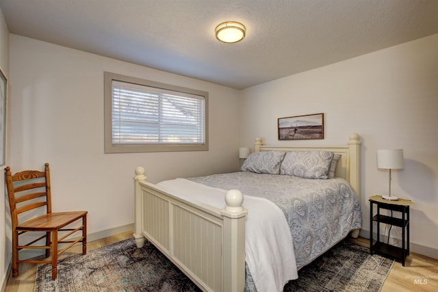 8561 W Goddard, Boise, ID 83704 - bedroom with baseboards and wood finished floors