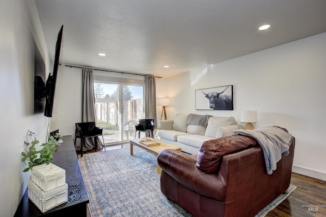 8561 W Goddard, Boise, ID 83704 - living area with baseboards, recessed lighting, dark wood-type flooring, and a textured ceiling