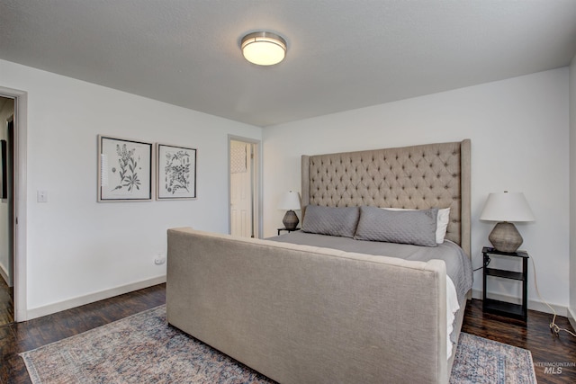 8561 W Goddard, Boise, ID 83704 - bedroom with dark wood-style floors and baseboards