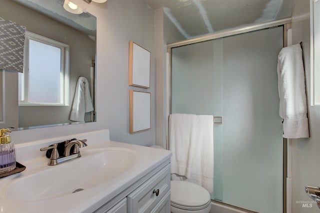 8561 W Goddard, Boise, ID 83704 - bathroom with a shower stall, toilet, and vanity