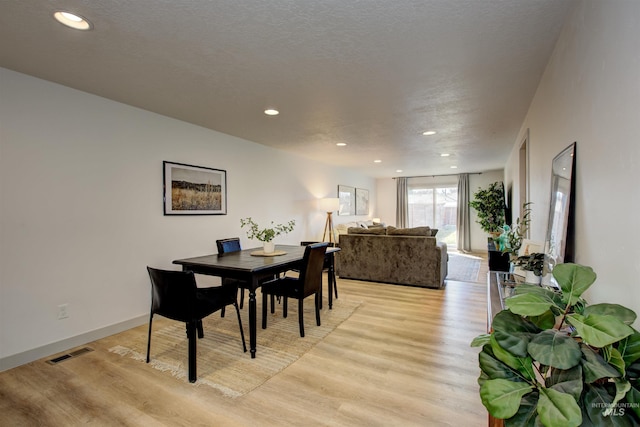 8561 W Goddard, Boise, ID 83704 - dining space featuring visible vents, light wood-style flooring, recessed lighting, and a textured ceiling