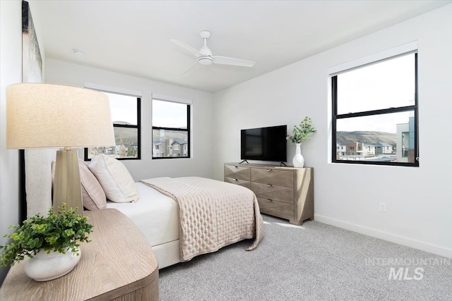 4184 E Haystack St Unit 206, Boise, ID 83716 - carpeted bedroom featuring baseboards and a ceiling fan