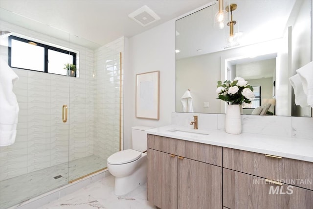 4184 E Haystack St Unit 206, Boise, ID 83716 - bathroom featuring vanity, toilet, a shower stall, and marble look tiles