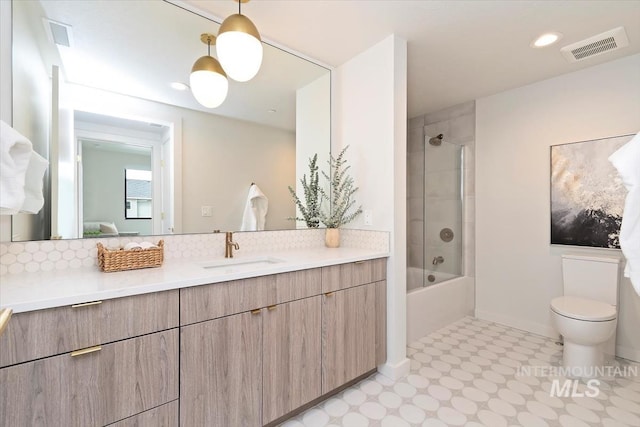 4184 E Haystack St Unit 206, Boise, ID 83716 - full bath with tile patterned floors, vanity, toilet,  shower combination, and backsplash
