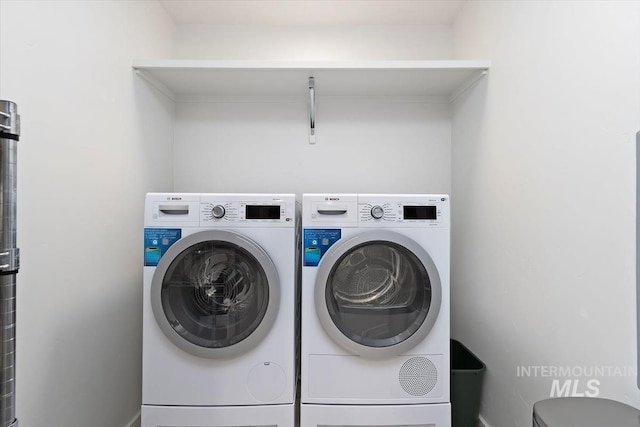 4184 E Haystack St Unit 206, Boise, ID 83716 - laundry area featuring washer and dryer and baseboards