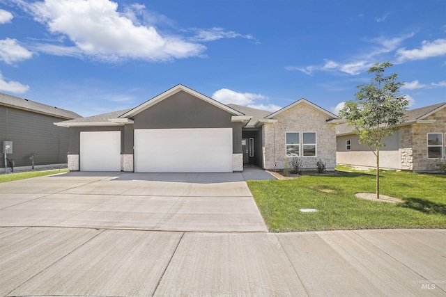 ranch-style home with a garage, a front lawn, concrete driveway, and stucco siding