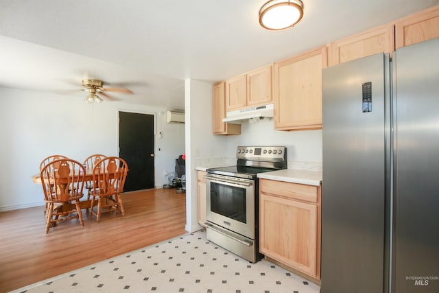 1765 W 6th St, Weiser, ID 83672 - kitchen featuring appliances with stainless steel finishes, light brown cabinets, under cabinet range hood, and a ceiling fan